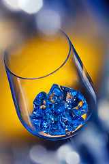 Image showing ice in wineglass on color background