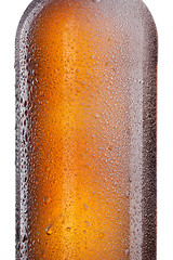 Image showing Beer bottle with water drops and frost isolated on white