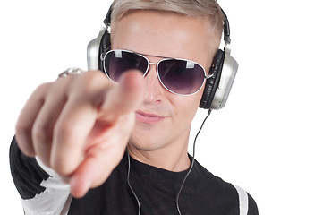 Image showing Man with headphones pointing her finger