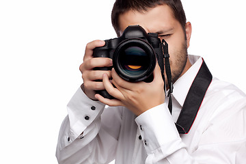 Image showing Young man taking photo with professional camera