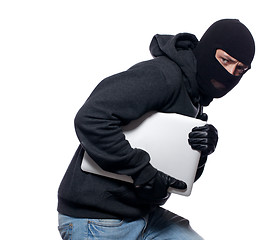 Image showing Thief stealing a laptop computer