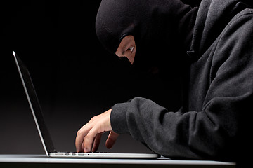 Image showing Computer hacker in a balaclava