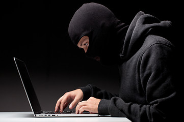 Image showing Computer hacker in a balaclava
