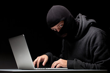 Image showing Computer hacker in a balaclava