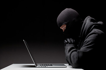 Image showing Computer hacker in a balaclava