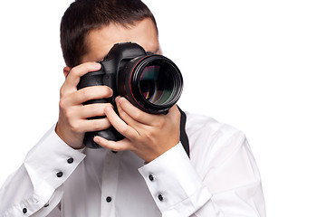 Image showing Young man taking photo with professional camera