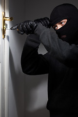 Image showing Thief Burglar opening  door