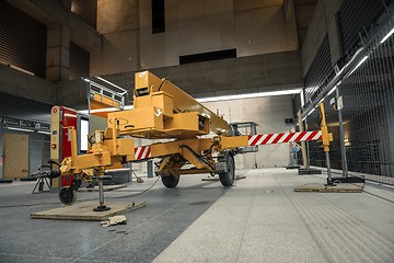 Image showing Yellow mobile industrial crane in a building