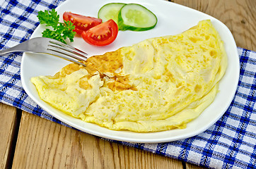 Image showing Omelette with vegetables on the board