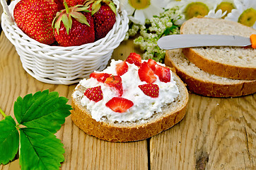 Image showing Bread with curd cream and strawberries with a basket