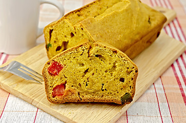 Image showing Fruitcake pumpkin with candied fruit on a napkin