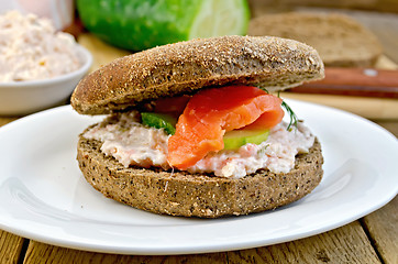 Image showing Sandwich with cream and salmon on the board