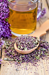 Image showing Herbal tea of oregano with a spoon in a mug