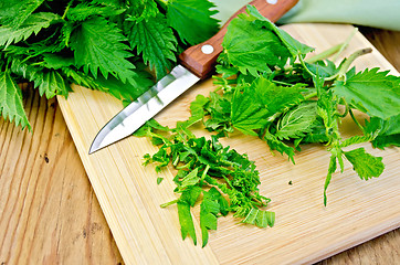 Image showing Nettle on the board with a knife and napkin