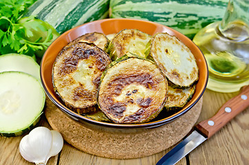 Image showing Zucchini fried with garlic on a board