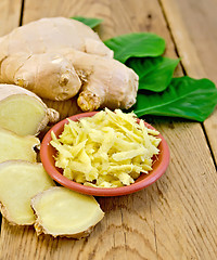 Image showing Ginger fresh grated in a bowl with the root