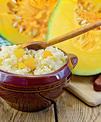 Image showing Porridge millet with pumpkin and spoon