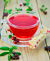 Image showing Tea with granola and lingonberries