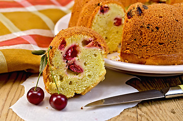 Image showing Cake with berries cherries and napkin on the board