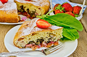 Image showing Pie with strawberry and sorrel on the board