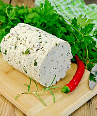 Image showing Cheese homemade with spices and pepper on the board