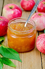 Image showing Jam apple with apples and spoon on the board