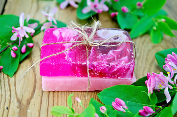 Image showing Soap homemade pink with flowers of honeysuckle