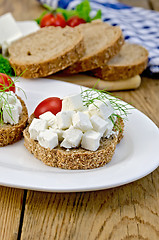Image showing Bread with feta cheese and tomatoes on the board