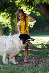 Image showing Little girl with dog