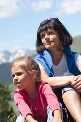 Image showing Mother with her daughter relaxing in the mountain