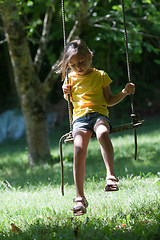 Image showing Little girl on seesaw