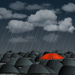 Image showing Red umbrella over many dark ones