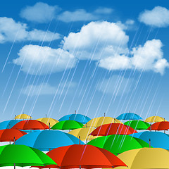 Image showing Colorful umbrellas in rain.