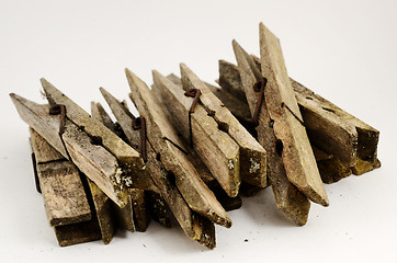 Image showing dirty old wooden clothespins 