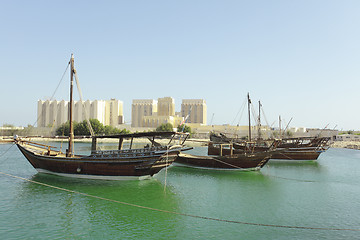 Image showing Dhows and Doha Port buildings,