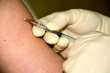 Image showing nurse is giving an injection