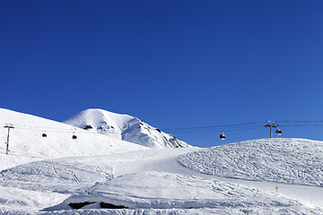 Image showing Gondola lift and ski slope at nice day