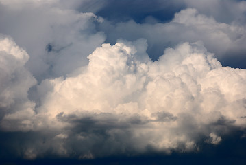 Image showing cumulus clouds illuminated by the sun 