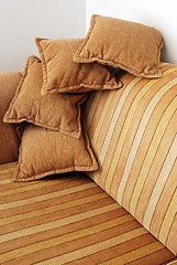 Image showing striped brown sofa and four pillows