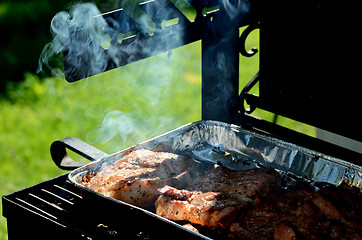 Image showing meat is roasted on the grill