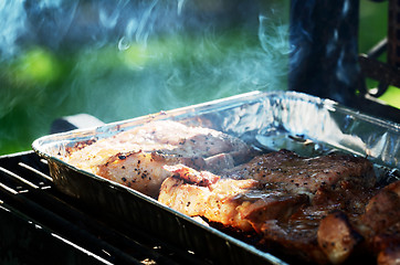 Image showing meat is roasted on the grill