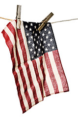 Image showing american flag on a clothesline with wooden clothespins