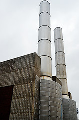 Image showing two metal chimney against the gray sky