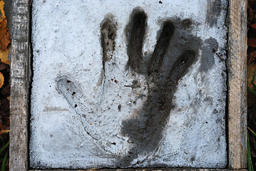 Image showing handprint in cement