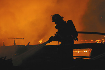 Image showing firefighter in silhouette