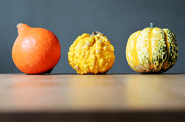 Image showing three pumpkins in a row 