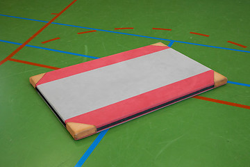 Image showing Very old red mat on a blue court