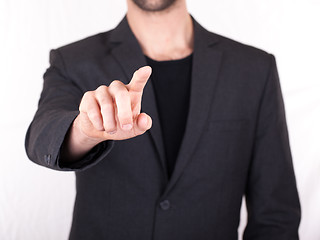 Image showing Businessman pressing an imaginary button