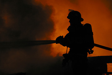 Image showing firefighter in silhouette