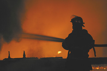 Image showing firefighter in silhouette